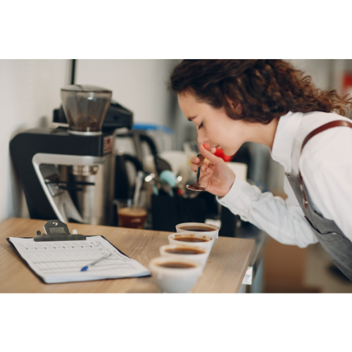 Black Crown Coffee Co. blind cupping with woman tasting and evaluating different coffees